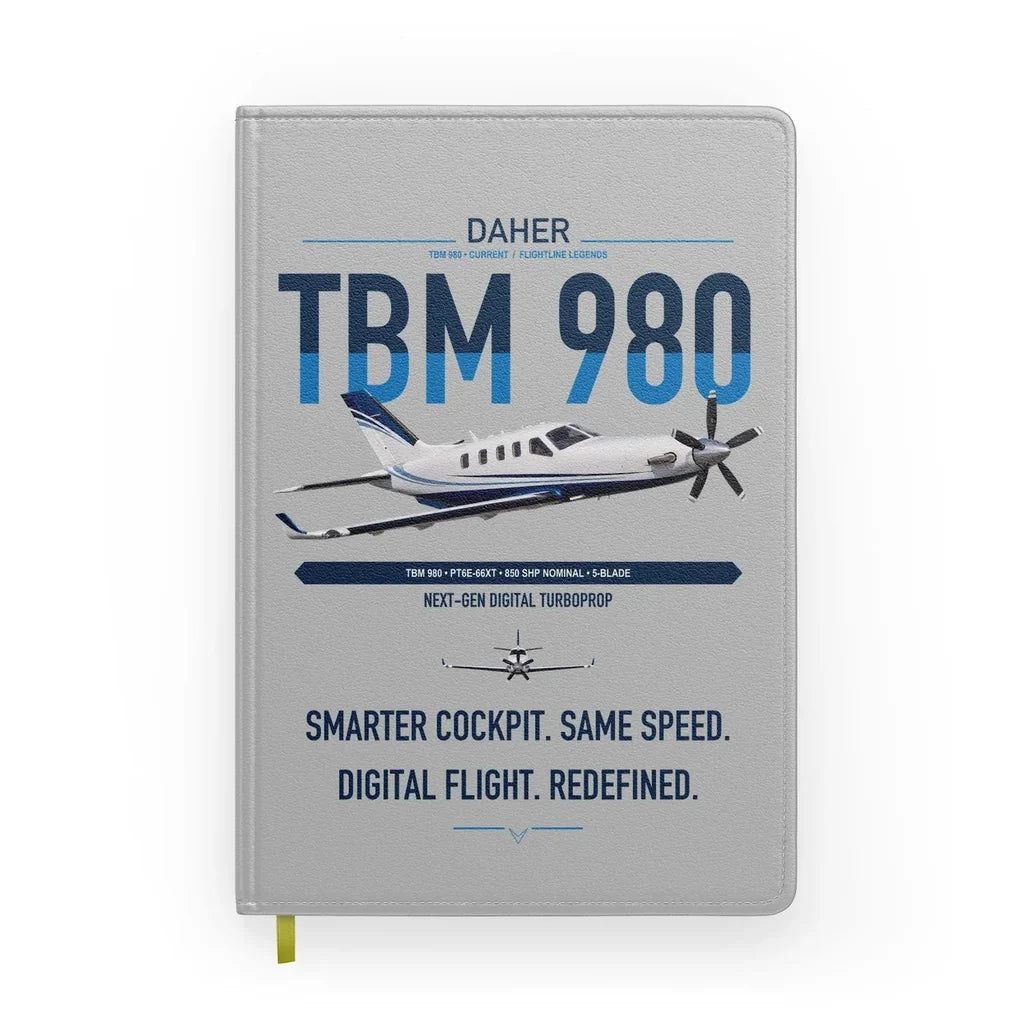 Daher TBM 980 design on light gray notebook