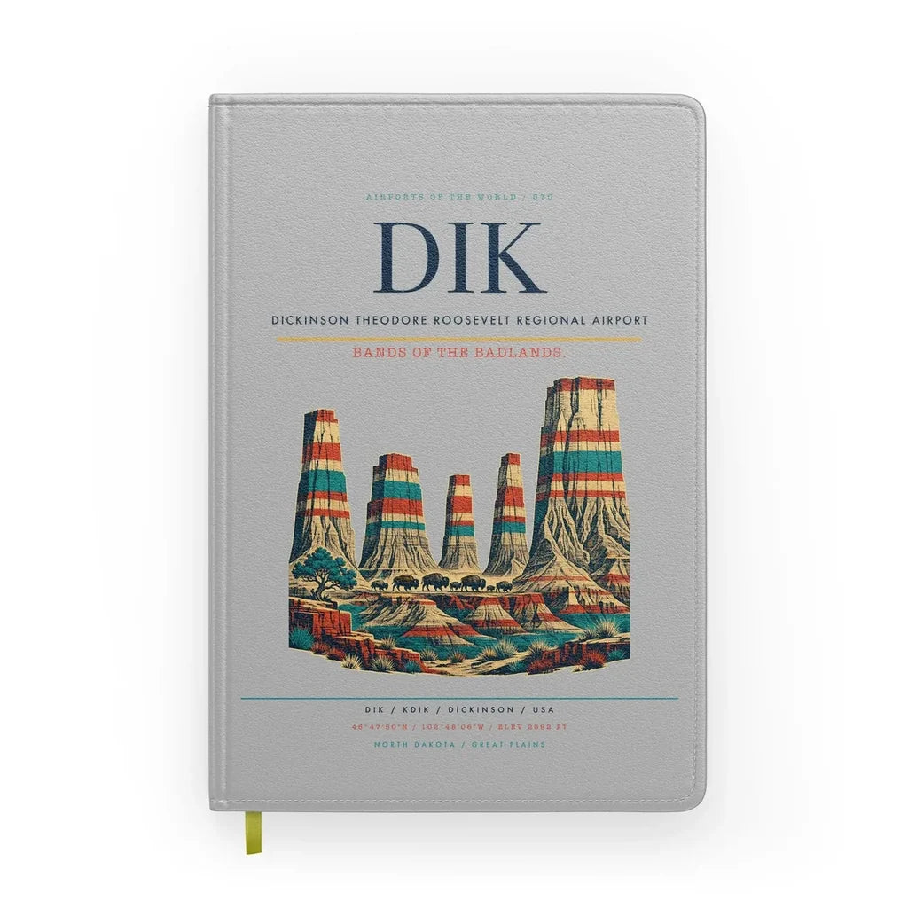Dickinson Theodore Roosevelt Regional Airport (DIK) design on light gray notebook