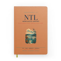 Thumbnail for Newcastle Airport (NTL) design on orange notebook