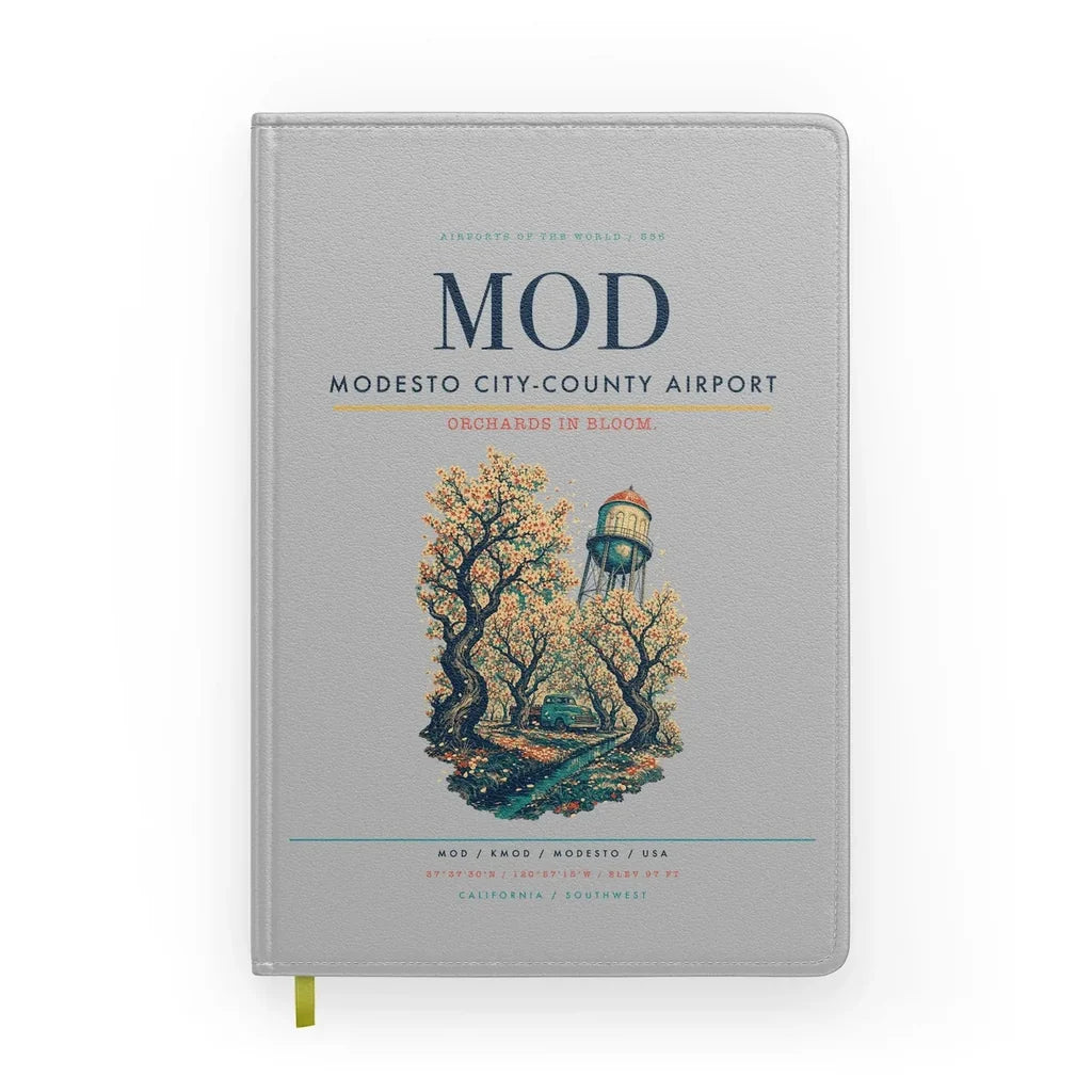 Modesto City-County Airport (MOD) design on light gray notebook
