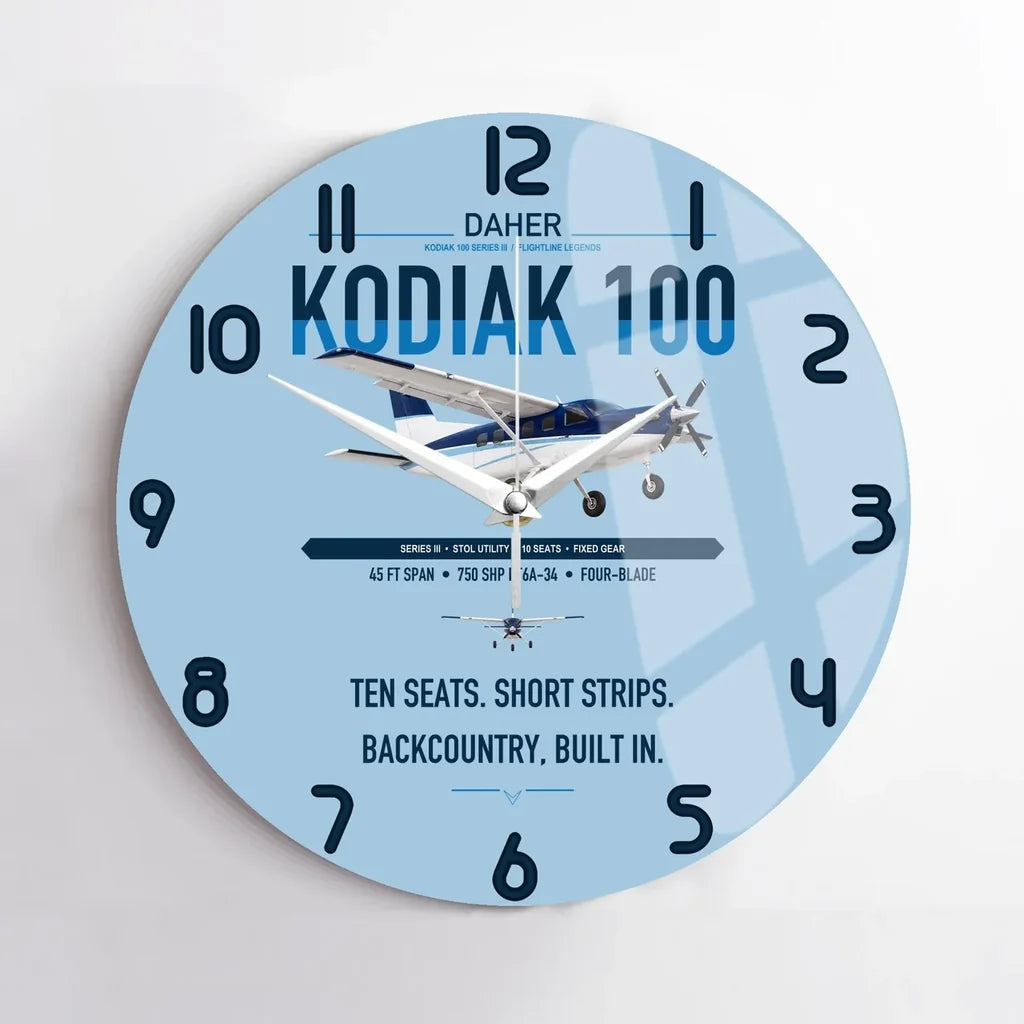 Daher Kodiak 100 Series III design on light blue no frame wall clock