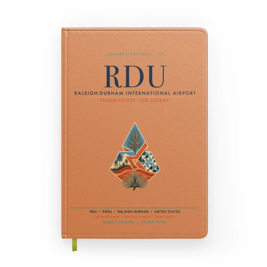 Raleigh-Durham International Airport (RDU) design on orange notebook