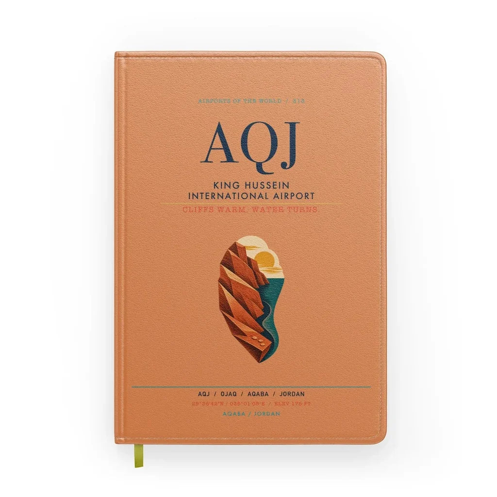 King Hussein International Airport (AQJ) design on orange notebook
