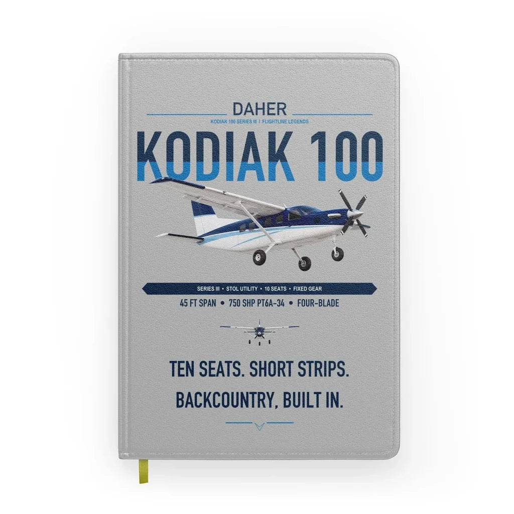 Daher Kodiak 100 Series III design on light gray notebook