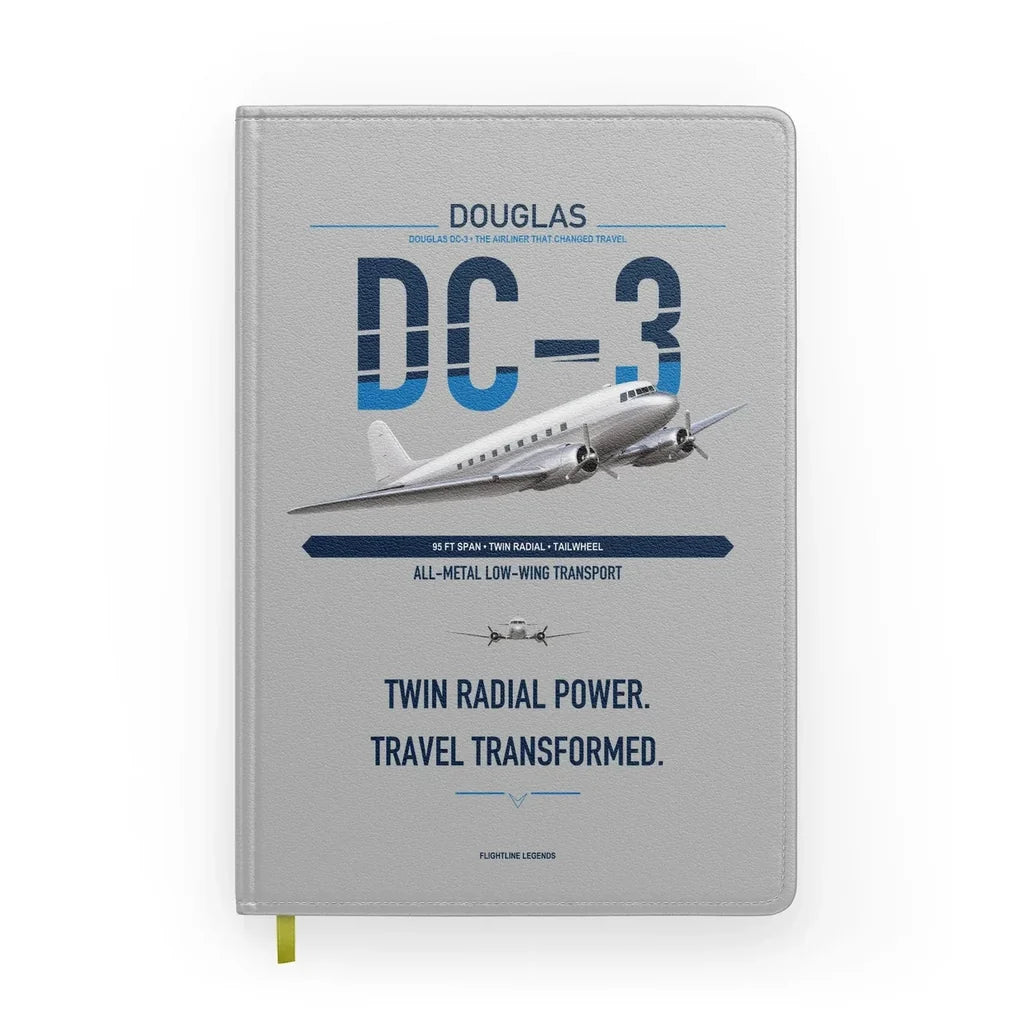 Douglas DC-3 design on light gray notebook