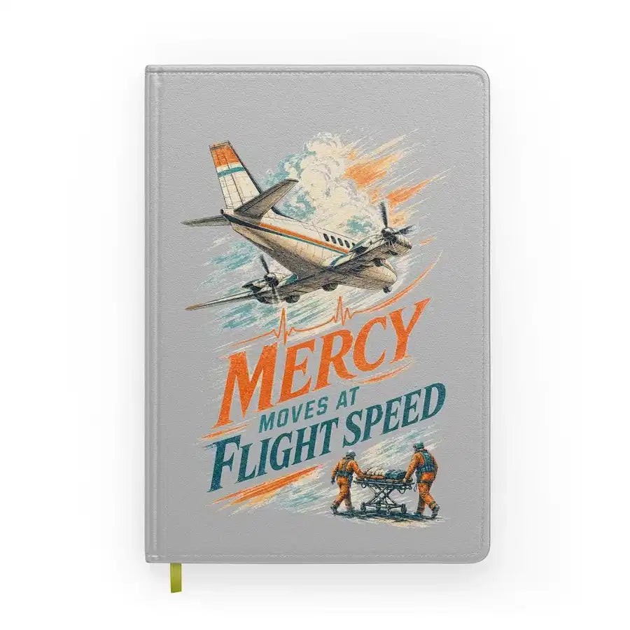 Mercy Moves At Flight Speed design on light gray notebook