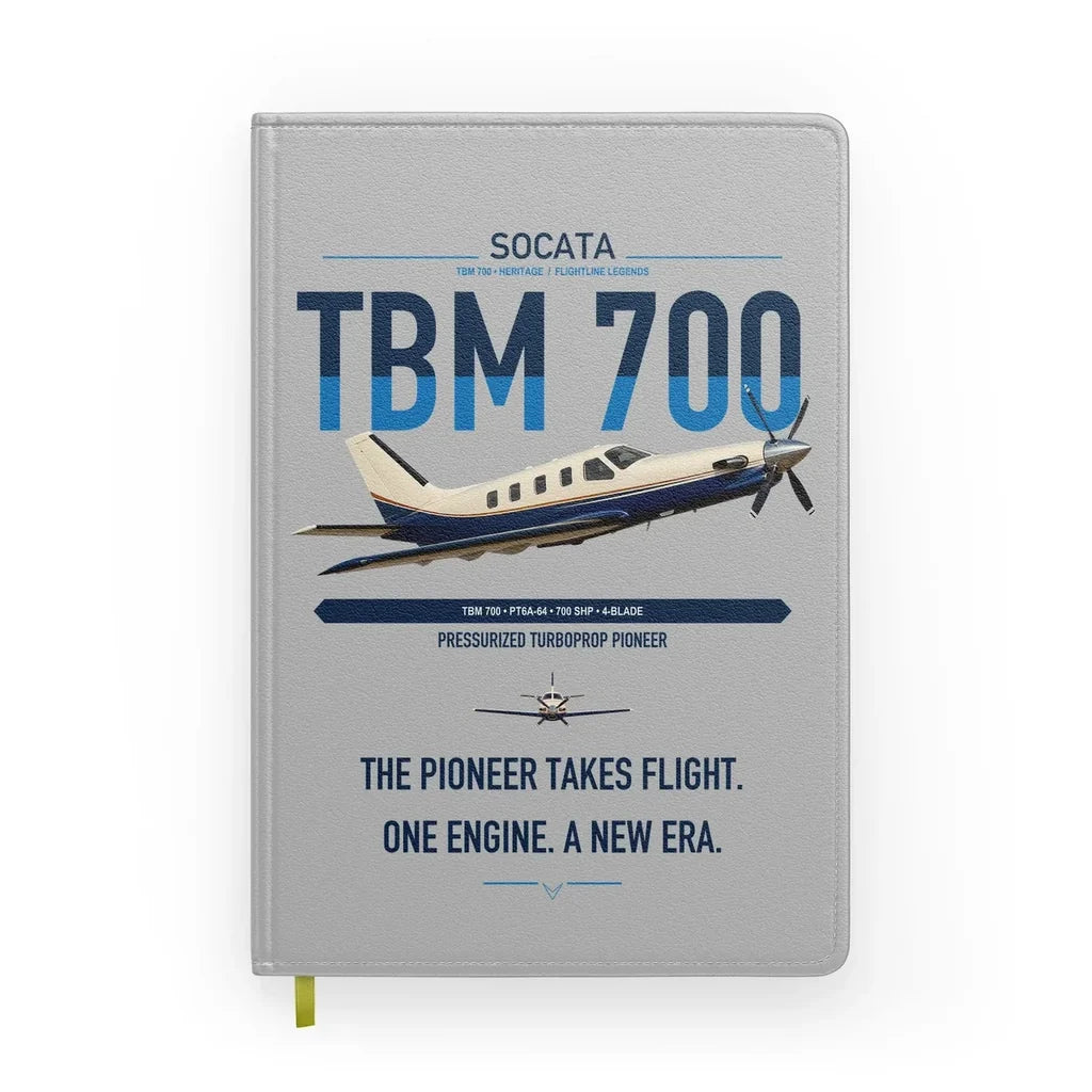 Socata TBM 700 design on light gray notebook
