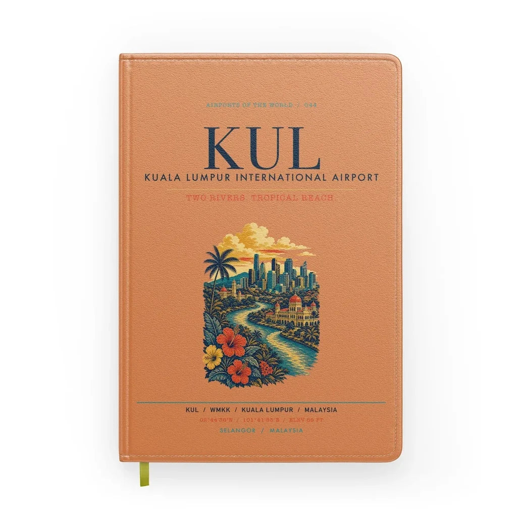 Kuala Lumpur International Airport (KUL) design on orange notebook