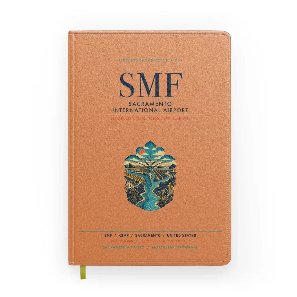 Sacramento International Airport (SMF) design on orange notebook