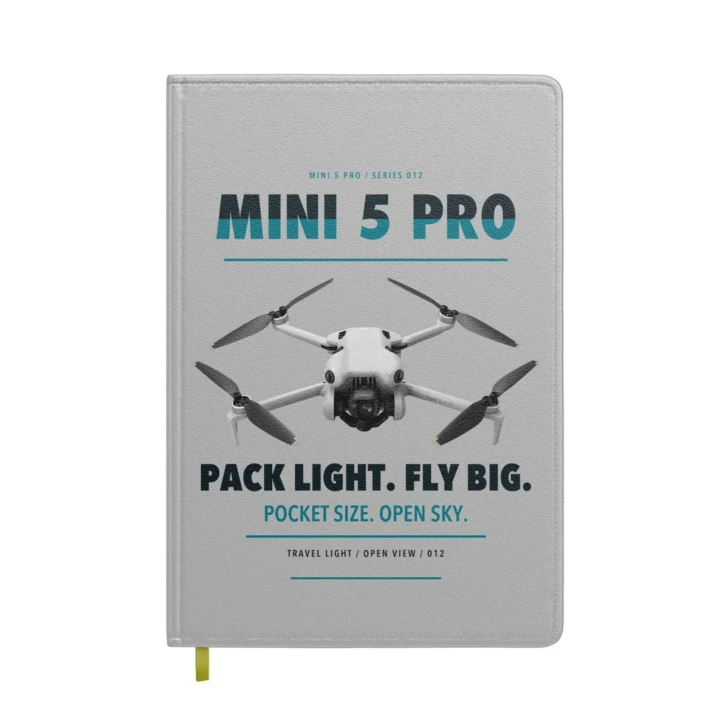 DJI Mini 5 Pro design on light gray notebook