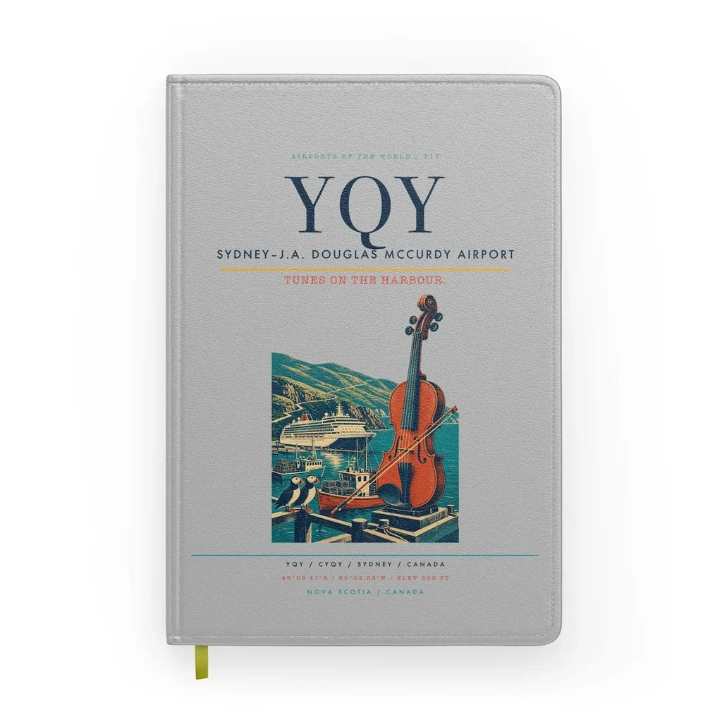 Sydney–J.A. Douglas McCurdy Airport (YQY) design on light gray notebook