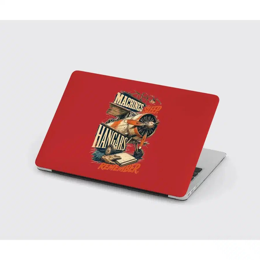 Machines Sleep. Hangars Remember. design on red MacBook case