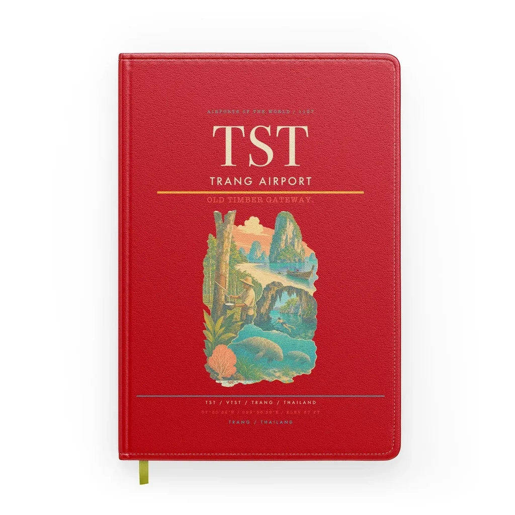 Trang Airport (TST) design on red notebook