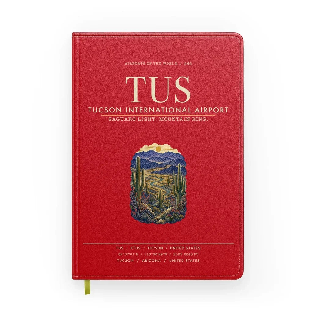 Tucson International Airport (TUS) design on red notebook
