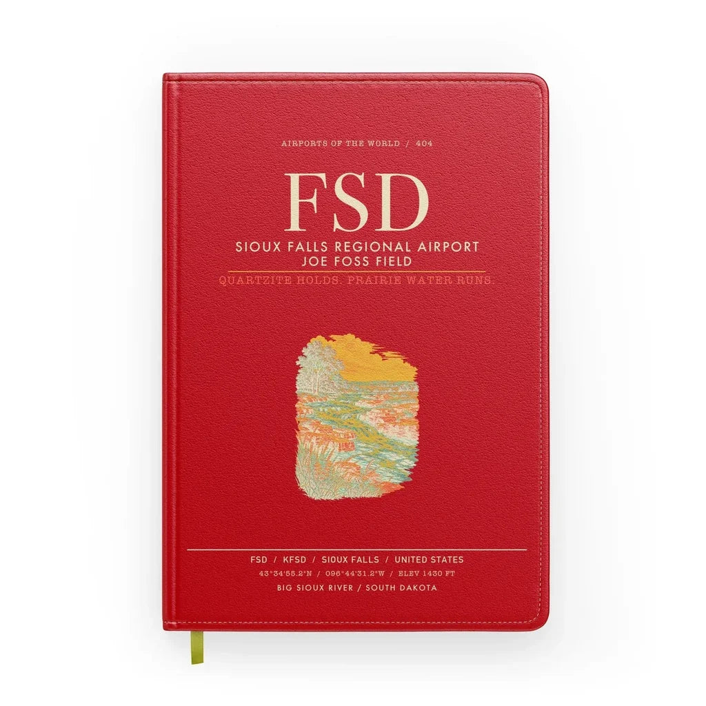 Sioux Falls Regional Airport Joe Foss Field (FSD) design on red notebook
