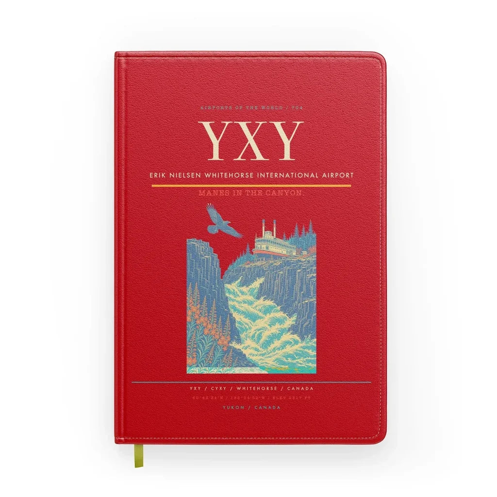 Erik Nielsen Whitehorse International Airport (YXY) design on red notebook