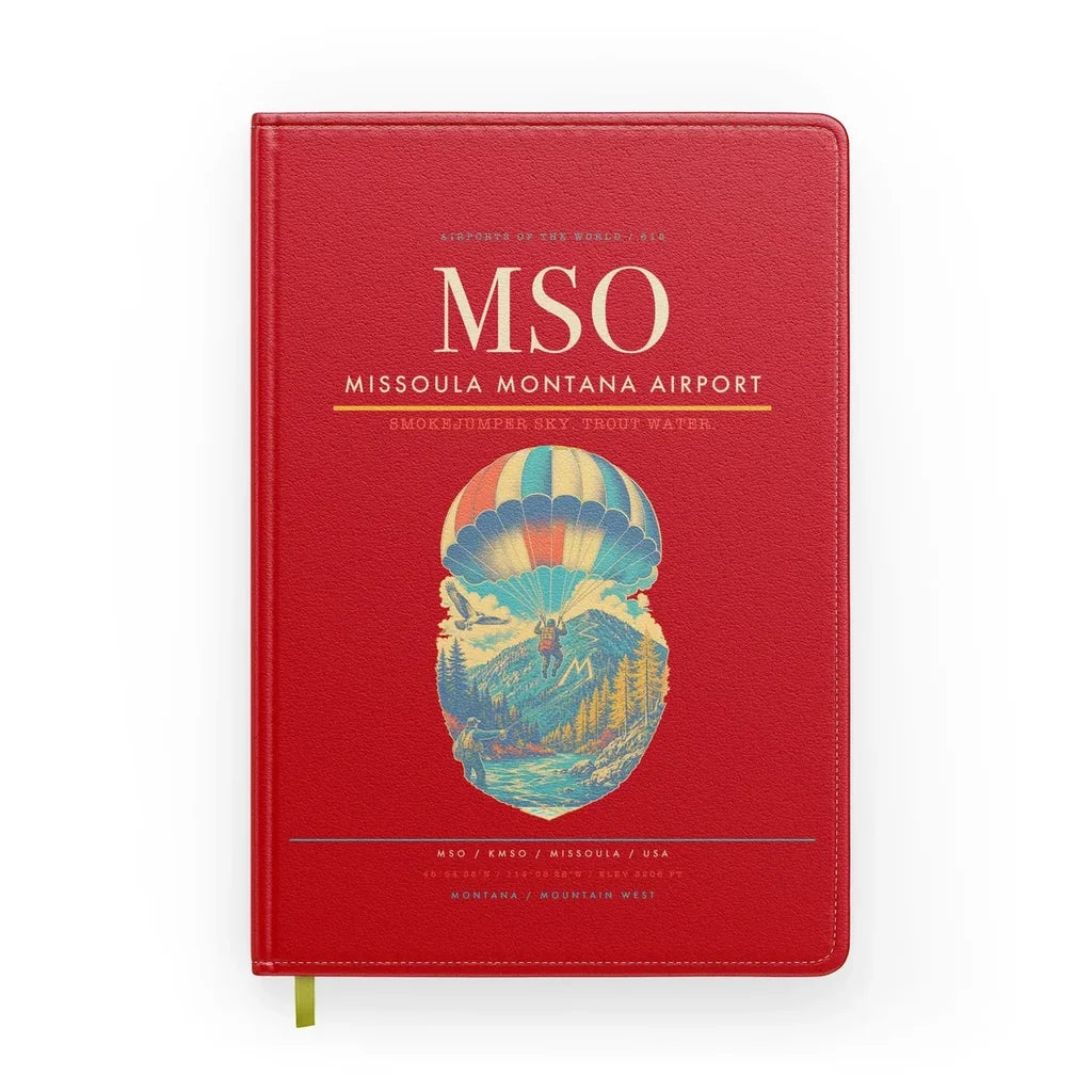 Missoula Montana Airport (MSO) design on red notebook