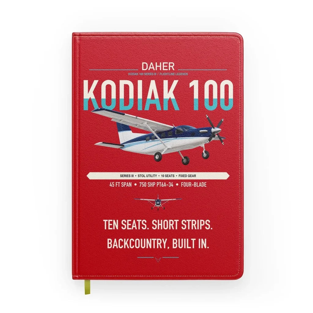 Daher Kodiak 100 Series III design on red notebook