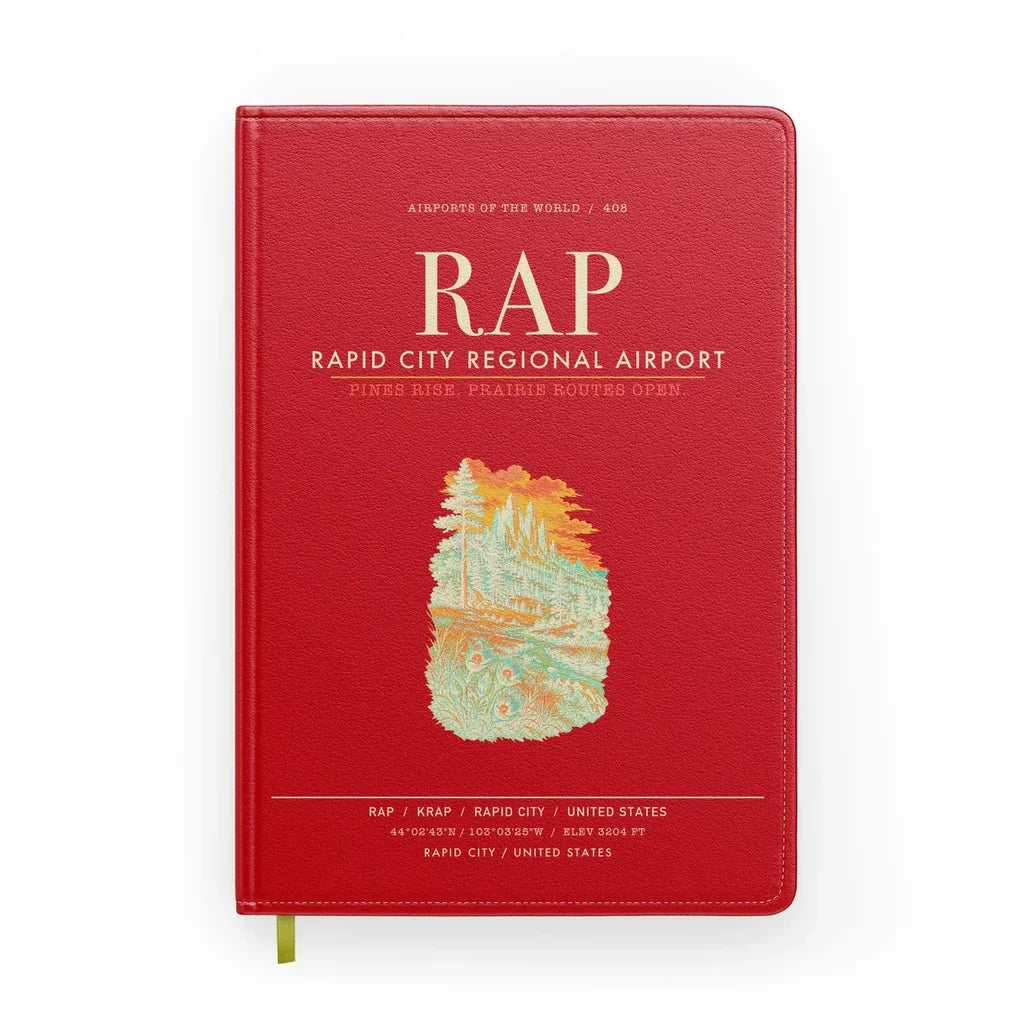 Rapid City Regional Airport (RAP) design on red notebook
