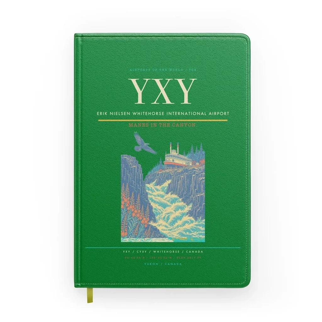 Erik Nielsen Whitehorse International Airport (YXY) design on green notebook