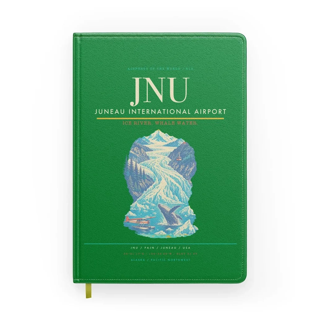 Juneau International Airport (JNU) design on green notebook