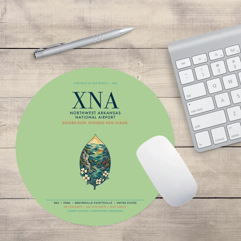 Northwest Arkansas National Airport (XNA) design on light green round mouse pad