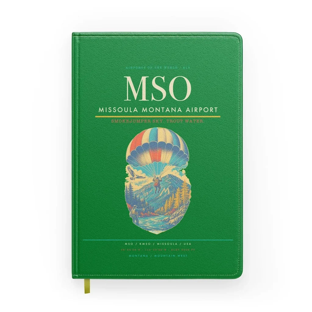 Missoula Montana Airport (MSO) design on green notebook