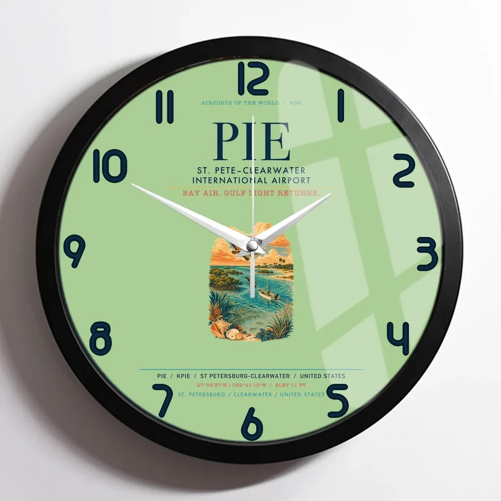 St. Pete–Clearwater International Airport (PIE) design on light green framed wall clock