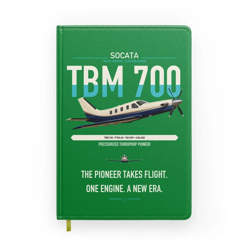 Socata TBM 700 design on green notebook