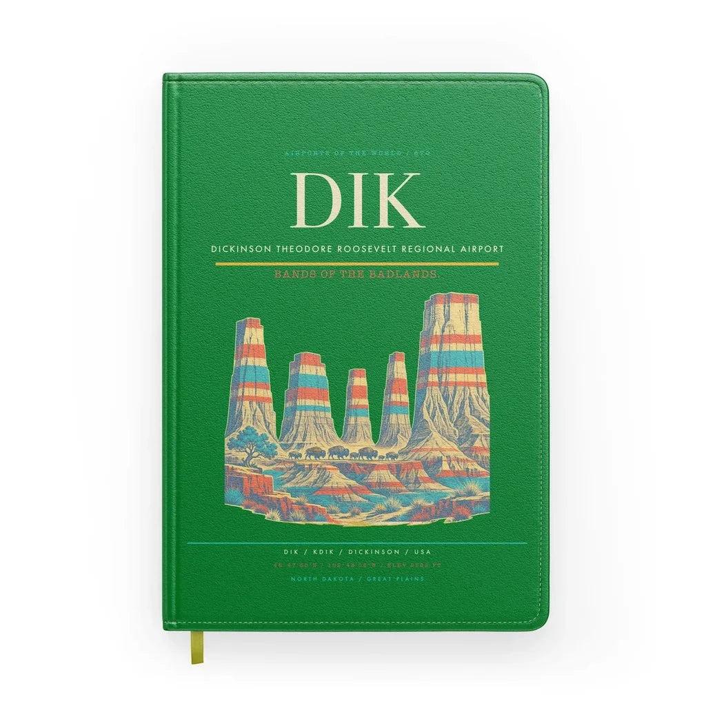 Dickinson Theodore Roosevelt Regional Airport (DIK) design on green notebook