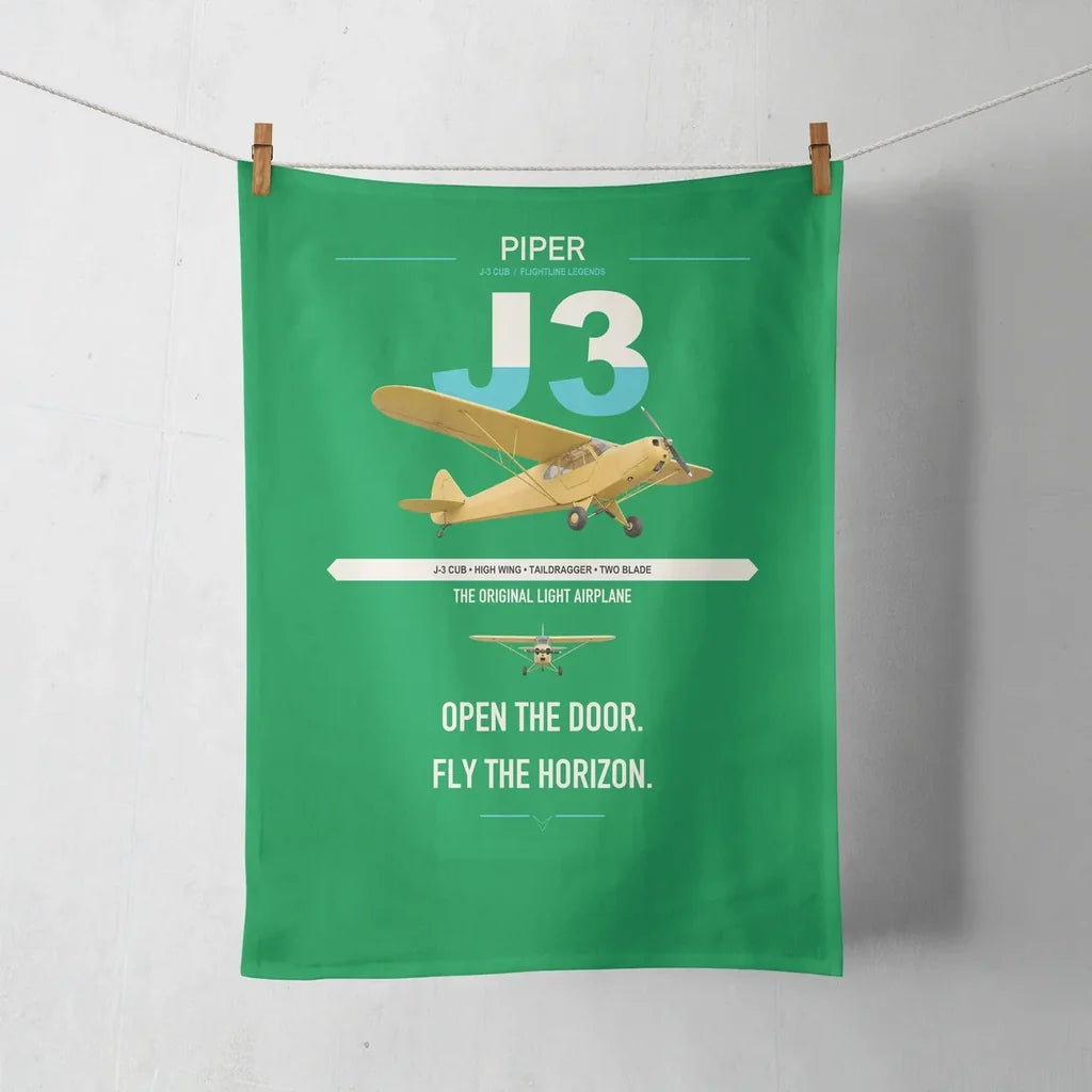 Piper J-3 Cub design on green towel