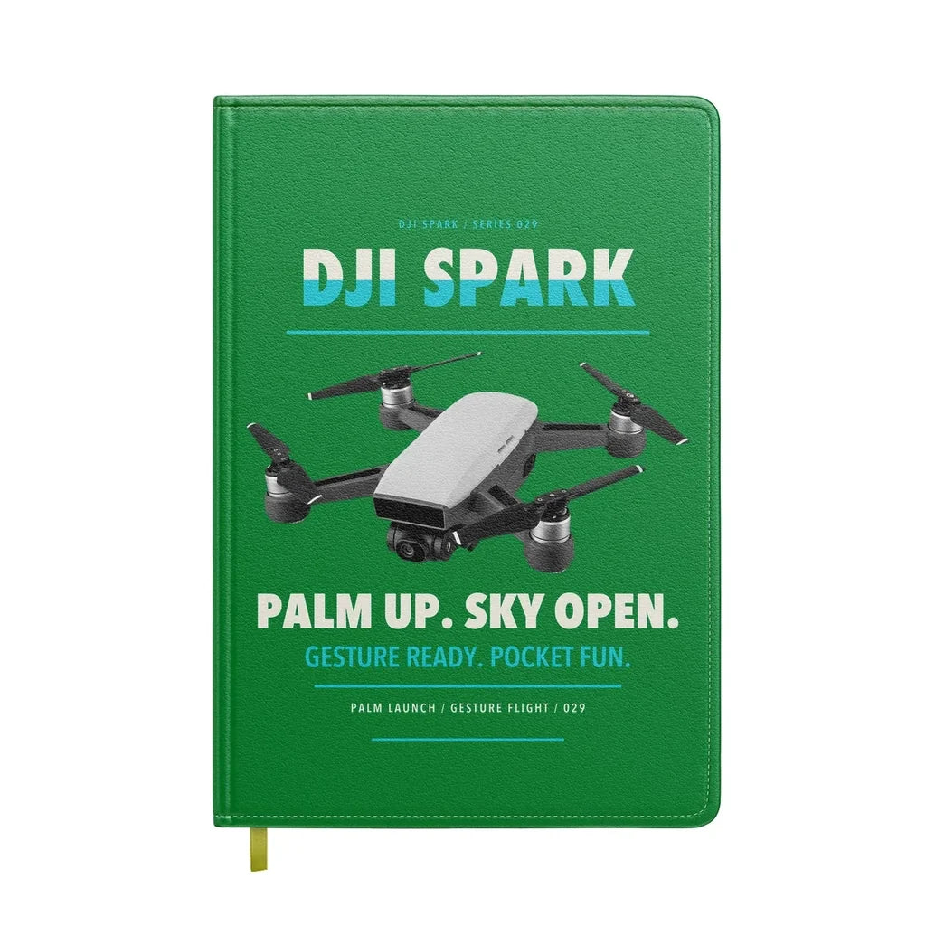 DJI Spark design on green notebook
