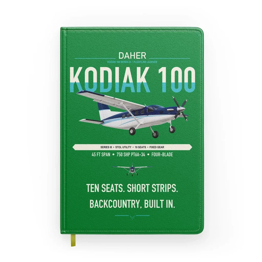 Daher Kodiak 100 Series III design on green notebook