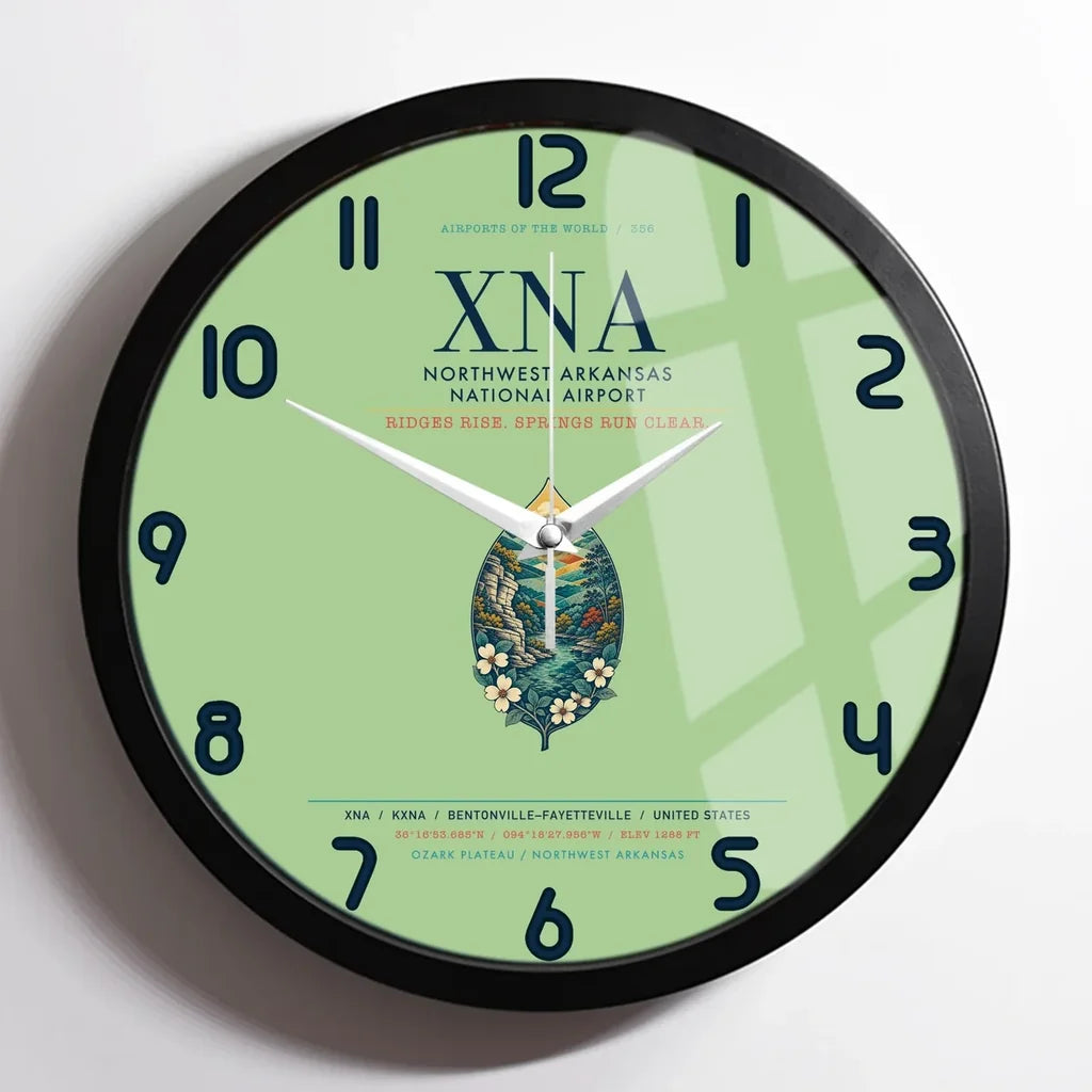 Northwest Arkansas National Airport (XNA) design on light green framed wall clock