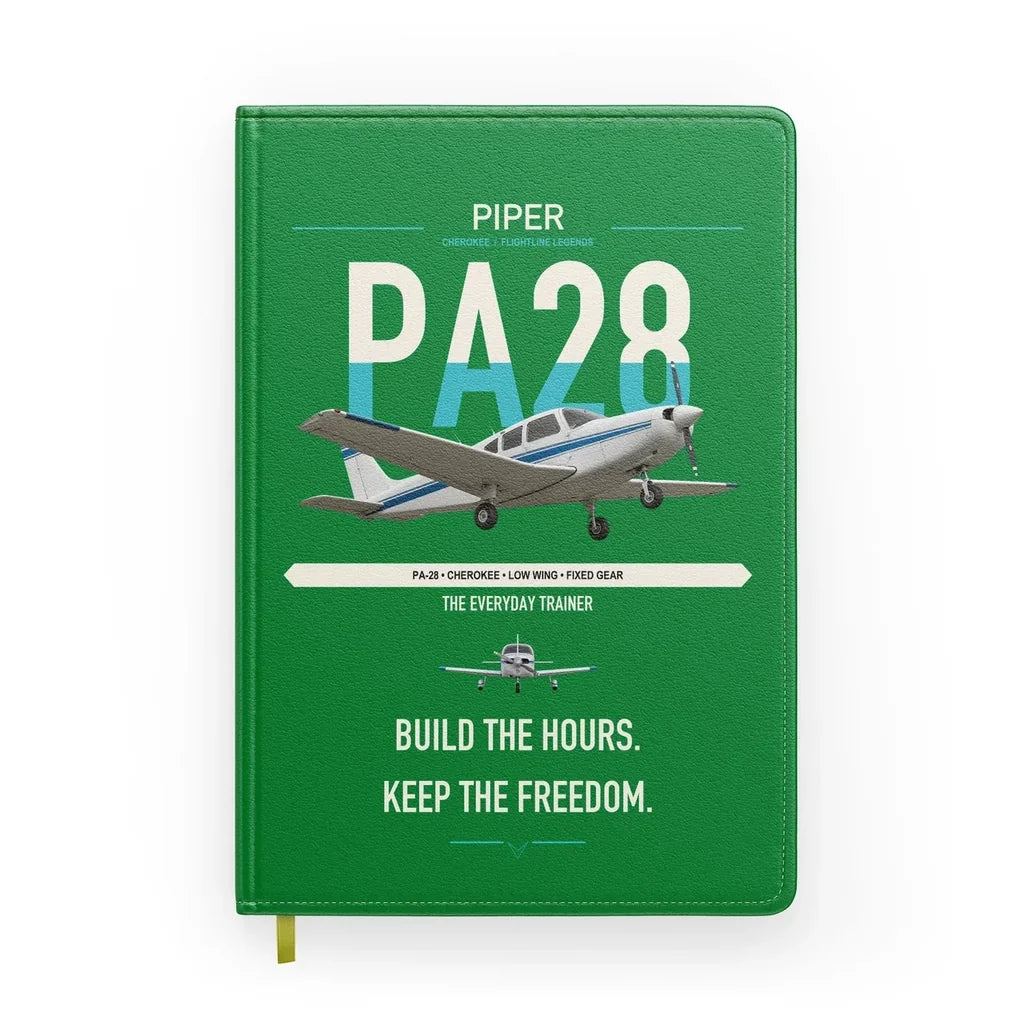 Piper PA-28 Cherokee design on green notebook