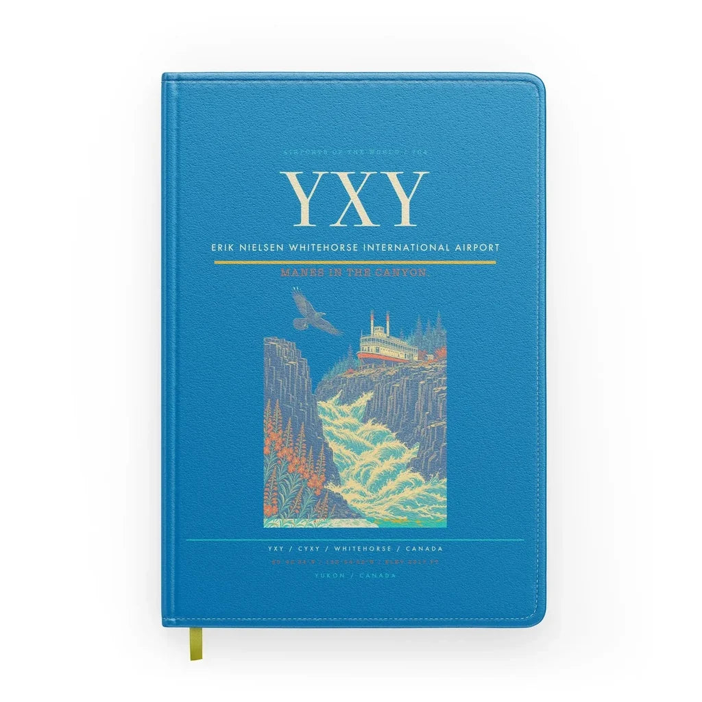 Erik Nielsen Whitehorse International Airport (YXY) design on turquoise notebook