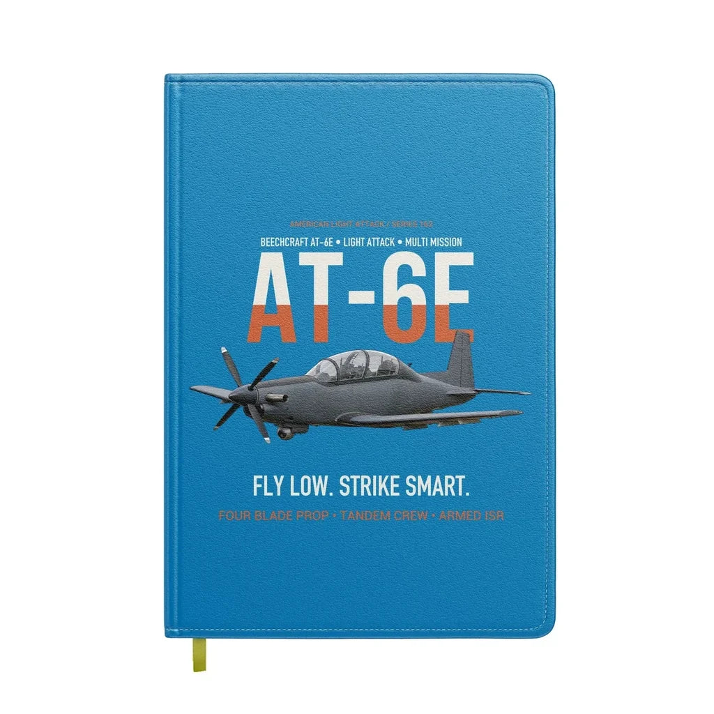AT-6E Wolverine Light Attack design on turquoise notebook