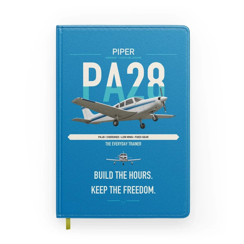 Piper PA-28 Cherokee design on turquoise notebook