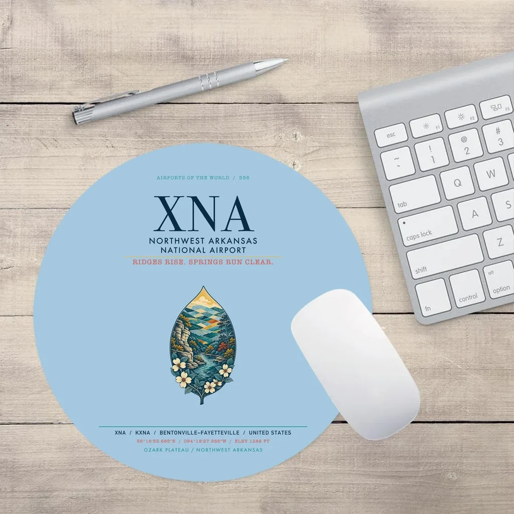 Northwest Arkansas National Airport (XNA) design on light blue round mouse pad