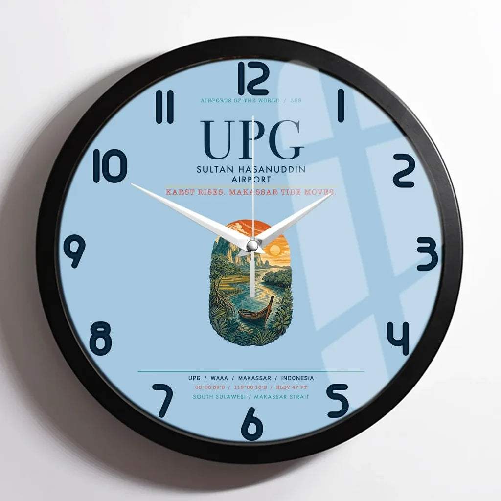 Sultan Hasanuddin Airport (UPG) design on light blue framed wall clock