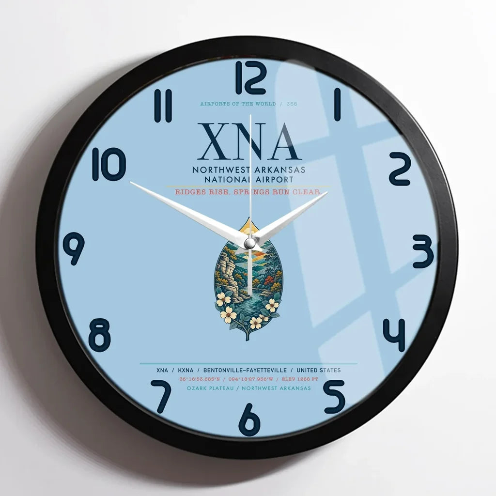 Northwest Arkansas National Airport (XNA) design on light blue framed wall clock