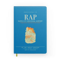 Thumbnail for Rapid City Regional Airport (RAP) design on turquoise notebook