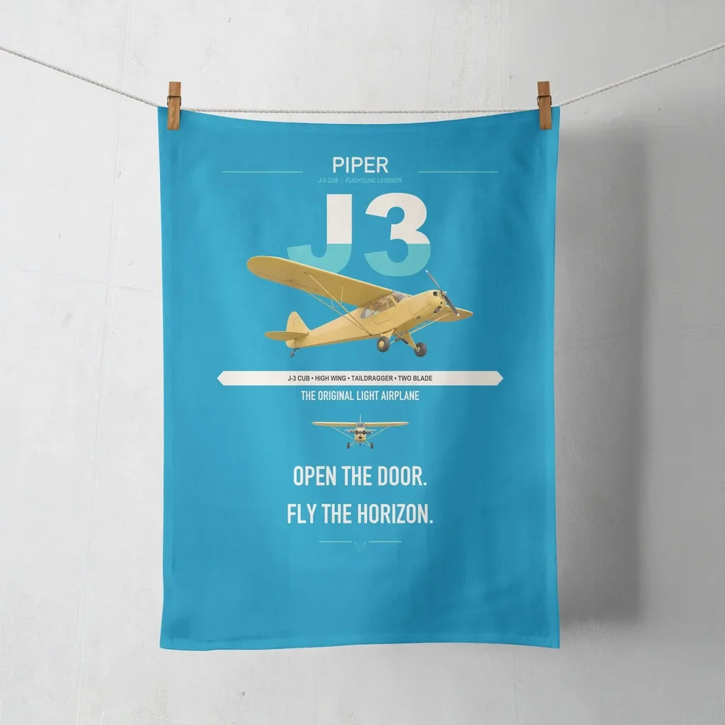 Piper J-3 Cub design on turquoise towel