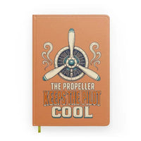 Thumbnail for The Propeller Keeps The Pilot Cool design on orange notebook