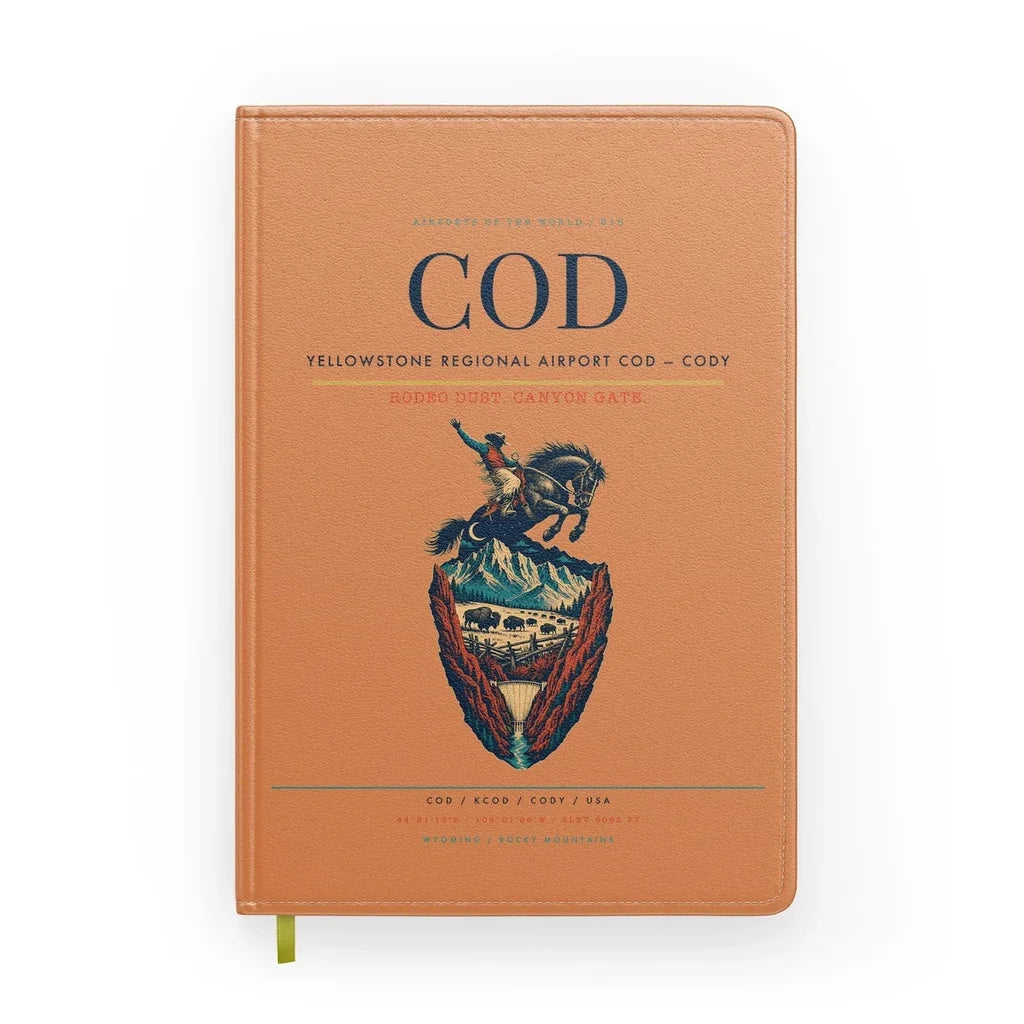 Yellowstone Regional Airport (COD) design on orange notebook