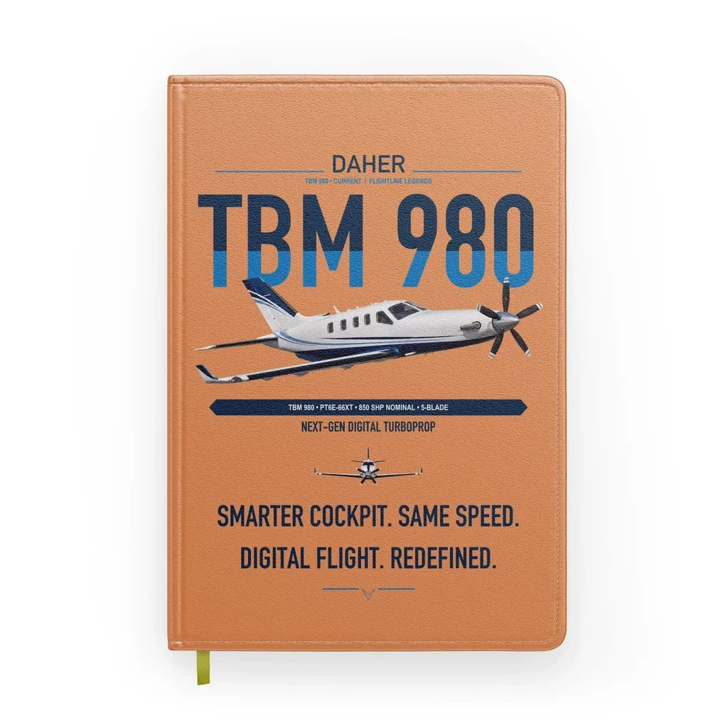 Daher TBM 980 design on orange notebook