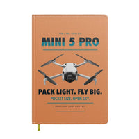 Thumbnail for DJI Mini 5 Pro design on orange notebook