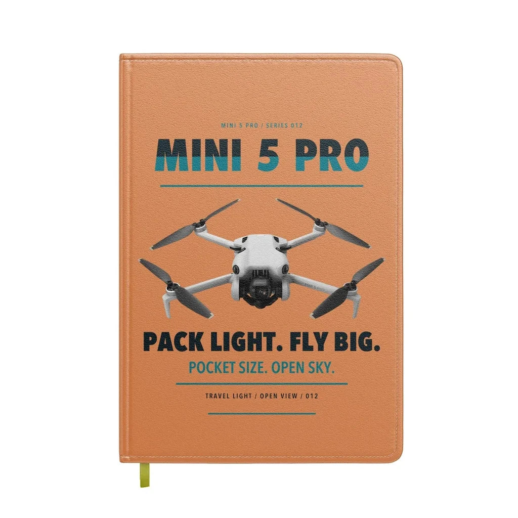 DJI Mini 5 Pro design on orange notebook