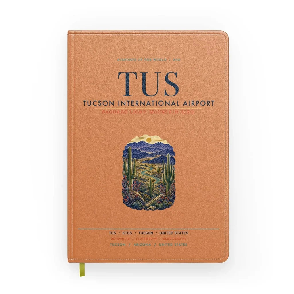 Tucson International Airport (TUS) design on orange notebook