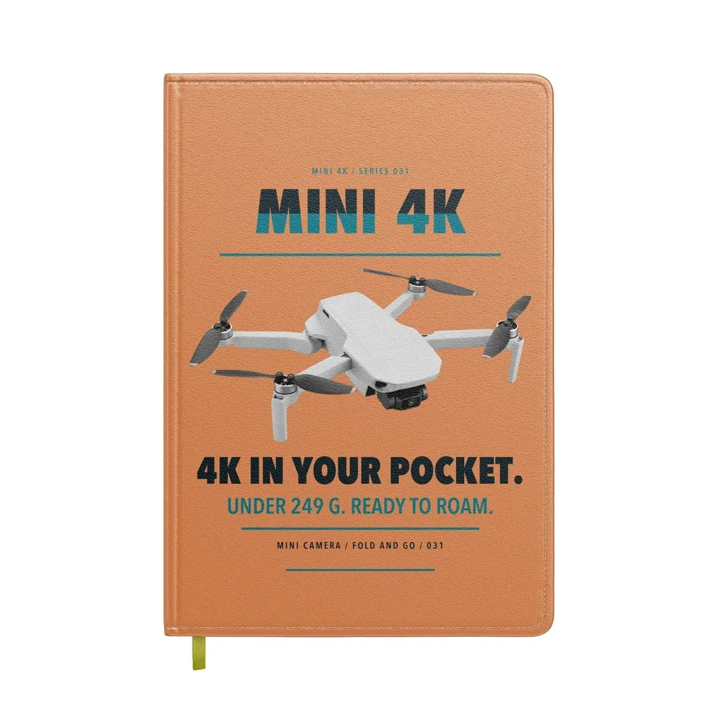 DJI Mini 4K design on orange notebook